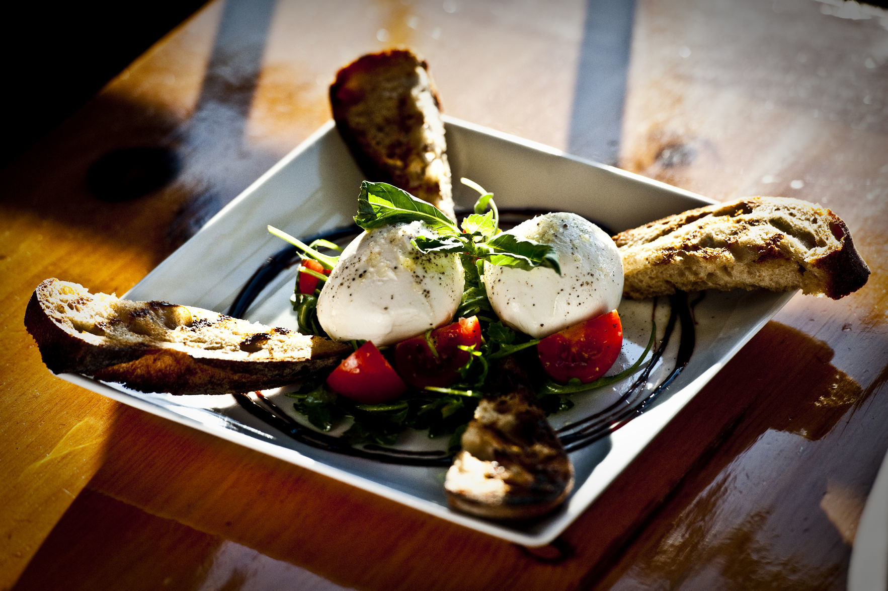 Burrata with tomato, arugula and French sourdough